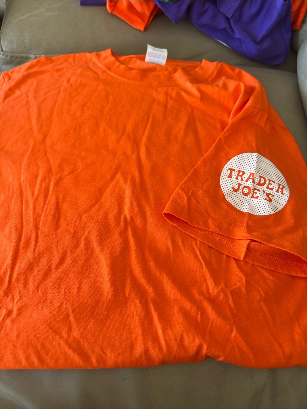 Trader Joe’s Orange Short-Sleeve Logo Tee.